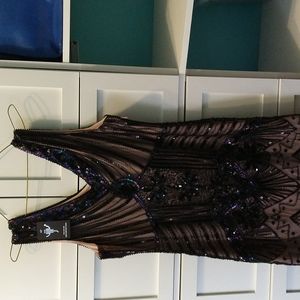 Woman size medium vintage dress with shingles at the bottom